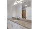 Bright bathroom features a granite countertop vanity, undermount sink, and a large mirror at 860 Peachtree Ne St # 2815, Atlanta, GA 30308