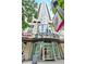 Exterior view of building entrance with glass doors and nearby food establishments at 860 Peachtree Ne St # 2815, Atlanta, GA 30308