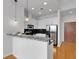 Modern kitchen featuring stainless steel appliances, white cabinets, black countertops and eat in bar at 860 Peachtree Ne St # 2815, Atlanta, GA 30308
