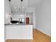 Bright and airy kitchen features granite countertops, breakfast bar, stainless appliances, and wood floors at 860 Peachtree Ne St # 2815, Atlanta, GA 30308