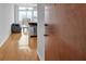 View of a living room, stainless steel appliances, balcony and wood flooring at 860 Peachtree Ne St # 2815, Atlanta, GA 30308
