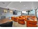Conference room featuring comfortable seating, wall lighting, and a large TV at 860 Peachtree Ne St # 2815, Atlanta, GA 30308