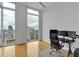 Bright office space with hardwood floors, large windows, and a modern desk setup and city view at 860 Peachtree Ne St # 2815, Atlanta, GA 30308