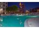 Outdoor pool with city skyline views at night with skyline and building interior lights at 860 Peachtree Ne St # 2815, Atlanta, GA 30308