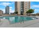 Outdoor pool with lounge chairs and views of nearby city buildings on a clear day at 860 Peachtree Ne St # 2815, Atlanta, GA 30308