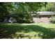 A well-maintained backyard features a green lawn with ample space, plus a patio area at 5170 Chamblee Dunwoody Rd, Atlanta, GA 30338