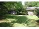 Expansive backyard with lush green lawn and patio area, ideal for outdoor enjoyment at 5170 Chamblee Dunwoody Rd, Atlanta, GA 30338