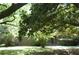 Traditional brick home with mature trees and a well-maintained lawn and landscaping at 5170 Chamblee Dunwoody Rd, Atlanta, GA 30338