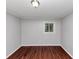 This is a simple bedroom with wood floors, clean walls, and minimal furnishings at 5326 Highway 5, Douglasville, GA 30135