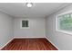This bedroom features sleek wood floors and natural light from the window at 5326 Highway 5, Douglasville, GA 30135