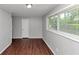 Bright bedroom with a large window and neutral walls at 5326 Highway 5, Douglasville, GA 30135