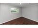 Bedroom featuring a large window and neutral-colored walls at 5326 Highway 5, Douglasville, GA 30135