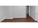 Room featuring hardwood floors, neutral-colored walls, and ample natural light at 5326 Highway 5, Douglasville, GA 30135