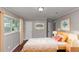 Cozy bedroom with wood floors, natural light, and comfortable furnishings at 5326 Highway 5, Douglasville, GA 30135