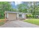 Attractive single-story home featuring an attached garage and stone details at 5326 Highway 5, Douglasville, GA 30135