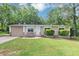 Charming single-story home with stone accents, attached garage, and well-manicured lawn at 5326 Highway 5, Douglasville, GA 30135