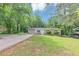 Inviting single-story home with a spacious front yard and convenient driveway access at 5326 Highway 5, Douglasville, GA 30135