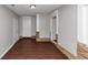 Room showcasing stone accents, neutral walls, and wood-look flooring at 5326 Highway 5, Douglasville, GA 30135