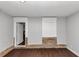 Room featuring stone accent walls, hardwood floors, and a neutral color palette at 5326 Highway 5, Douglasville, GA 30135