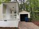 Backyard featuring a small garage, porch, and driveway, providing convenient parking and outdoor space at 1297 Cahaba Dr, Atlanta, GA 30311