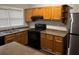 Functional kitchen with stainless steel appliances, wooden cabinets, and ample counter space at 1297 Cahaba Dr, Atlanta, GA 30311