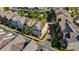 Aerial view of a neighborhood with townhomes, neatly arranged landscaping, and well-maintained streets at 265 Trecastle Sq, Canton, GA 30114