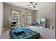 Comfortable bedroom with natural light, decorated with personal touches, and a cozy rug for warmth at 265 Trecastle Sq, Canton, GA 30114