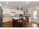 Gourmet kitchen featuring an island with bar seating, stainless steel appliances, and white cabinetry at 265 Trecastle Sq, Canton, GA 30114