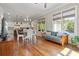 Open living space with hardwood floors connecting kitchen and dining with ample natural light at 265 Trecastle Sq, Canton, GA 30114