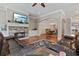 Open-concept living room with fireplace flows into adjacent dining area, perfect for entertaining at 265 Trecastle Sq, Canton, GA 30114