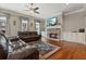 Spacious living room boasts a stone fireplace, plush seating, and built-in cabinets at 265 Trecastle Sq, Canton, GA 30114