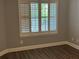Bedroom featuring wood floors and plantation shutters at 4828 Westridge Dr, Norcross, GA 30093