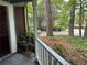 Cozy porch with a real estate sign, offering a glimpse of the surrounding neighborhood at 4828 Westridge Dr, Norcross, GA 30093