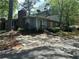 Charming home featuring a brick chimney, landscaped yard, and ample parking at 4828 Westridge Dr, Norcross, GA 30093