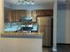 Cozy kitchen features granite countertops, stainless steel appliances, and a stylish backsplash at 4828 Westridge Dr, Norcross, GA 30093