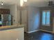 Inviting living room connected to the kitchen featuring plantation shutters and lots of natural light at 4828 Westridge Dr, Norcross, GA 30093