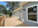 Exterior shot of a spacious wooden back deck, perfect for outdoor entertaining at 551 Lake Dr, Atlanta, GA 30354