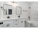 Modern bathroom featuring a double vanity with white cabinets, black fixtures, and a shower and tub combo at 551 Lake Dr, Atlanta, GA 30354