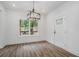 Bright dining room featuring hardwood floors and a modern light fixture at 551 Lake Dr, Atlanta, GA 30354