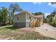 Recently renovated home with light green siding, a wood deck, and a concrete driveway at 551 Lake Dr, Atlanta, GA 30354