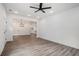 Spacious living area with recessed lighting, wood-look floors and an open floor plan that leads into the kitchen at 551 Lake Dr, Atlanta, GA 30354