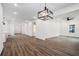 Expansive living area with recessed lighting, seamlessly transitioning to a kitchen and dining area at 551 Lake Dr, Atlanta, GA 30354