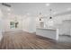 Open concept living space showcasing the kitchen with a breakfast bar at 551 Lake Dr, Atlanta, GA 30354