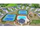 Community aerial view featuring swimming pool, playground, tennis courts, and well-maintained homes at 5650 Bergeson Ways, Cumming, GA 30028