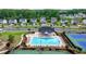 Community pool, tennis courts, playground, with lush landscaping, showcasing neighborhood amenities at 5650 Bergeson Ways, Cumming, GA 30028