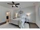 Bright bedroom with ceiling fan, decorative wall art, and an ensuite bathroom at 5650 Bergeson Ways, Cumming, GA 30028