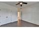 Bedroom features hardwood floors, ceiling fan and double door closet at 5650 Bergeson Ways, Cumming, GA 30028