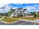 Community clubhouse with manicured landscaping, ample parking, and covered area at 5650 Bergeson Ways, Cumming, GA 30028