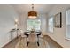 Bright dining area with a round table, stylish chairs, a modern light fixture and natural light at 5650 Bergeson Ways, Cumming, GA 30028