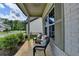 Relaxing front porch area with comfortable seating and attractive brick facade at 5650 Bergeson Ways, Cumming, GA 30028